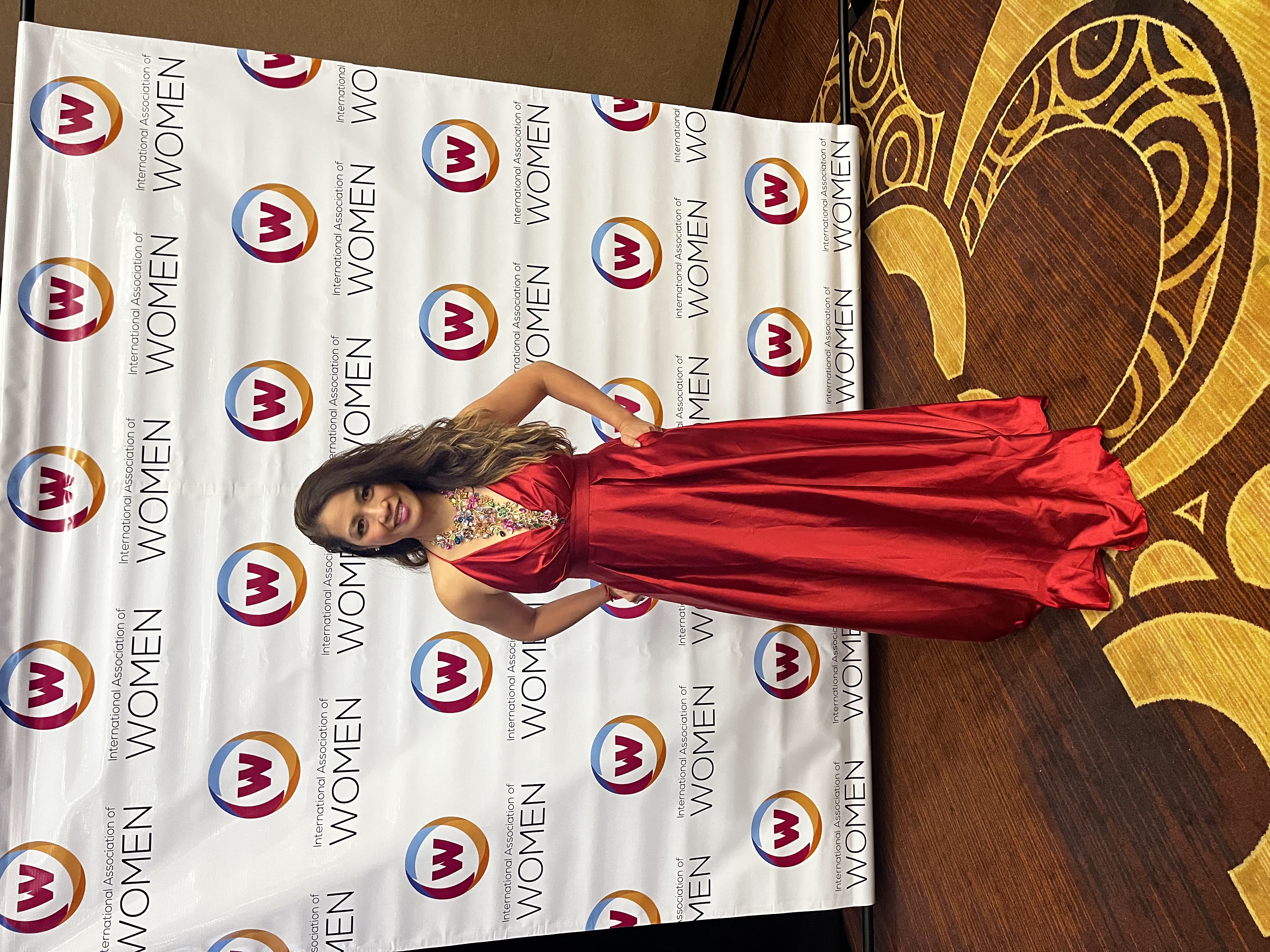 Kellie Sabas International Association of Women awards red dress